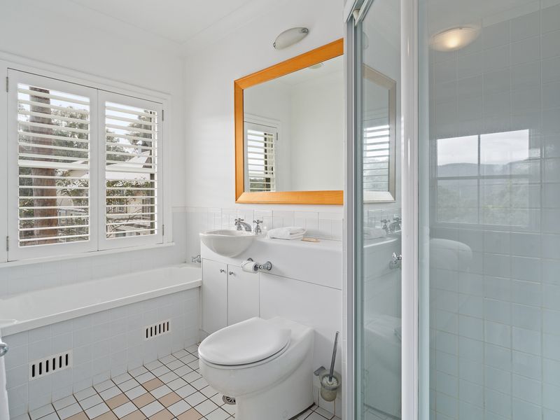 Modern Bathroom with Toilet, Shower, and Bath