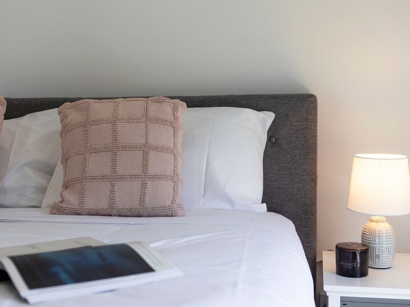 Serene guest bedroom with warm bedside glow