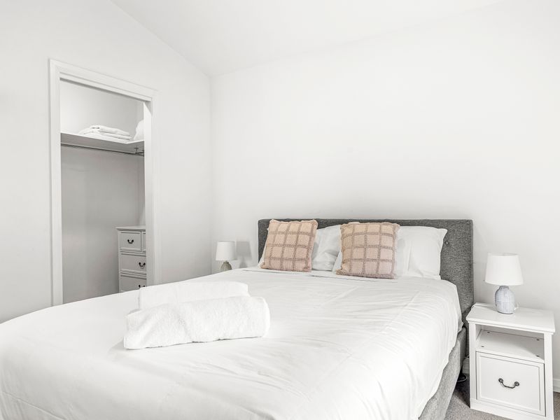 Bright and cozy bedroom with plush bedding and natural light
