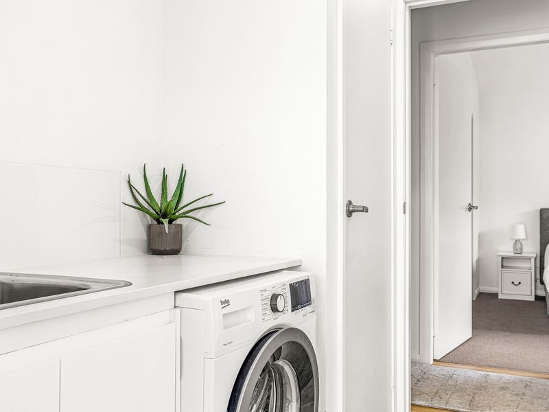 Compact laundry area with washer and dryer for your convenience