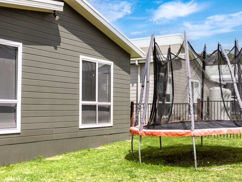 Spacious backyard with trampoline for fun afternoons