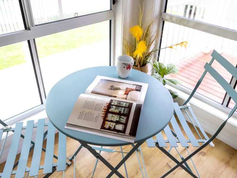 Cheerful breakfast nook with window views — perfect for morning coffee