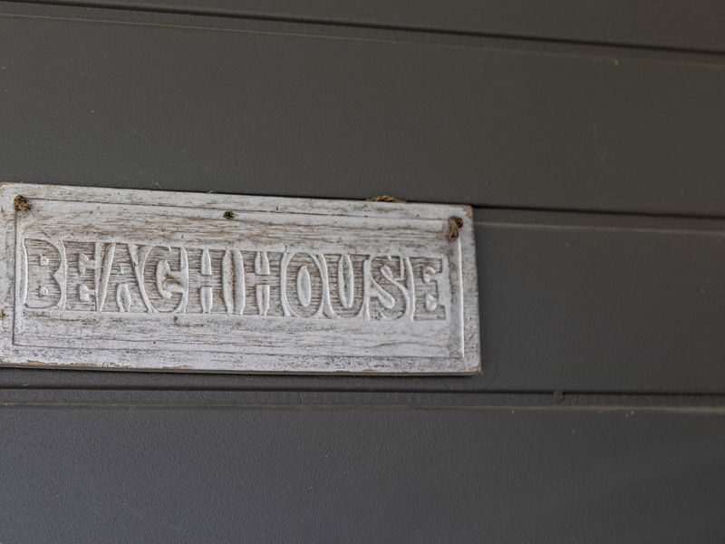 “Beach House” sign — your coastal escape awaits