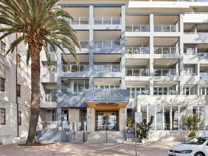 Welcoming building entrance just steps from the beach and local attractions.
