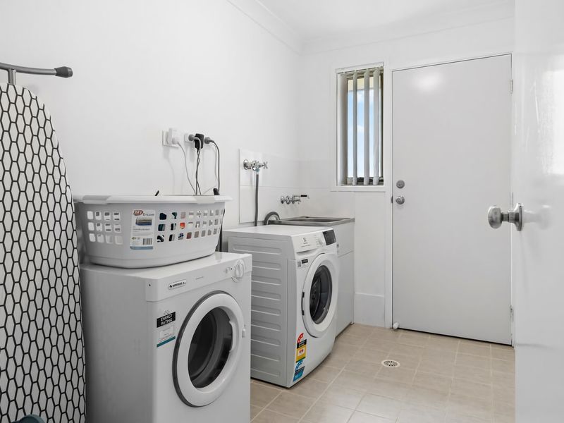 Dedicated laundry room with washer and dryer