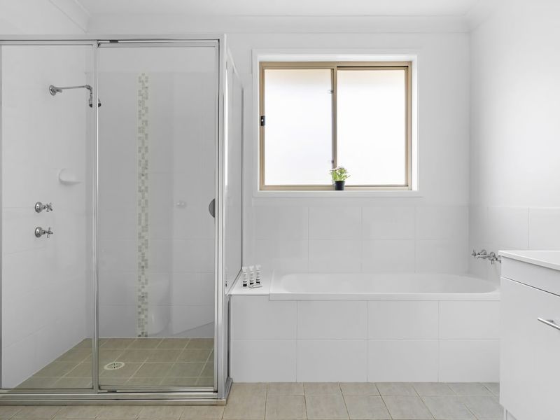 Spacious bathroom with bathtub—perfect for relaxing soaks