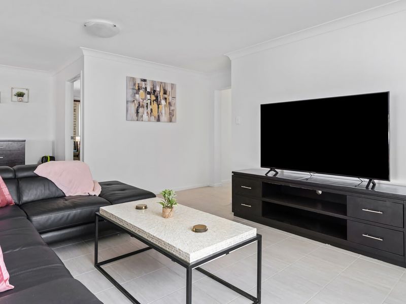 Spacious living room with smart TV and stylish décor