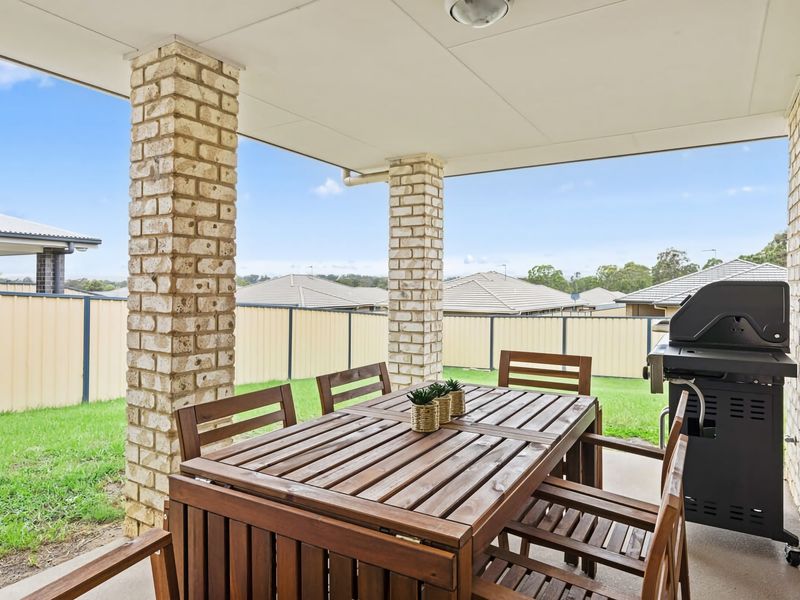 Covered outdoor dining area with BBQ for alfresco meals