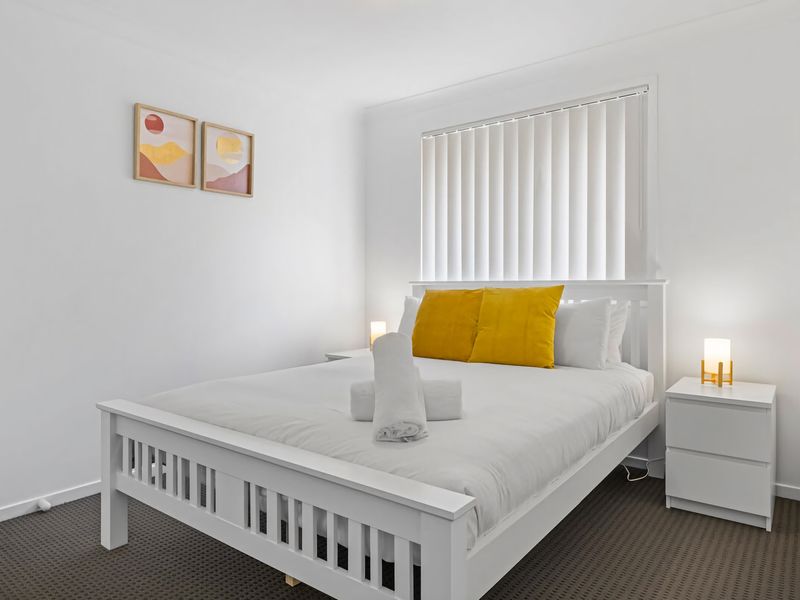 Bright guest bedroom with clean, modern styling