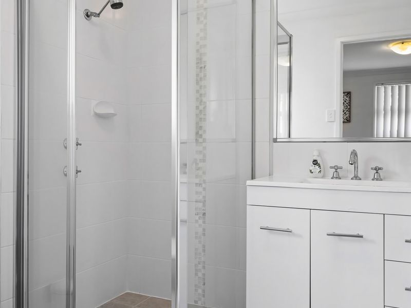 Clean and modern bathroom with vanity and shower
