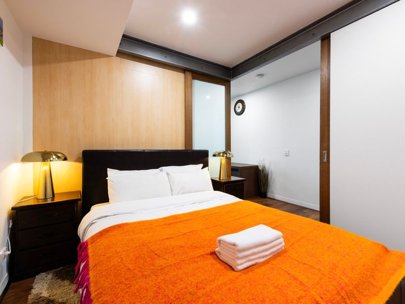 Cosy bedroom with soft lighting and fresh linens