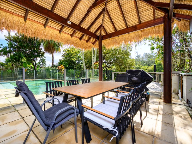 Relax and dine outdoors by the pool.