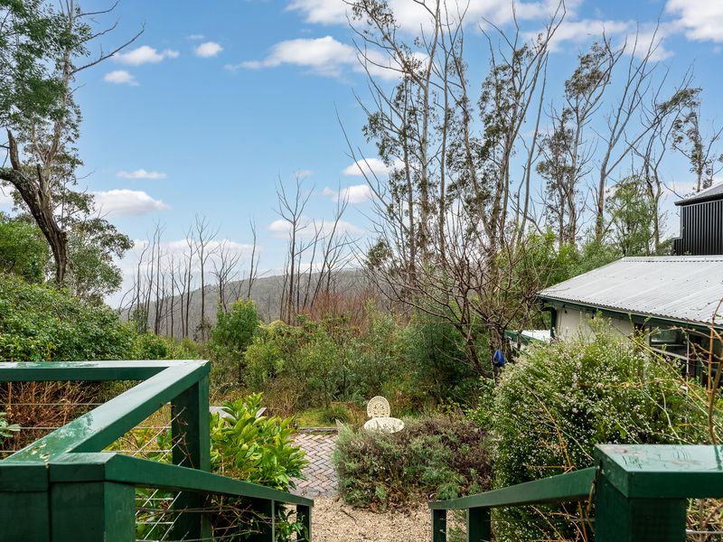 Outdoor area with glimpses of the surrounding landscape.