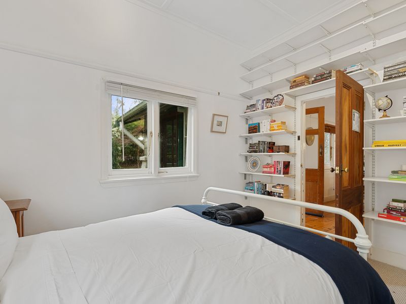 Second queen bedroom offering a warm, relaxing atmosphere.