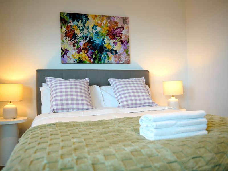 Peaceful bedroom with a comfortable bed for a good night’s sleep.