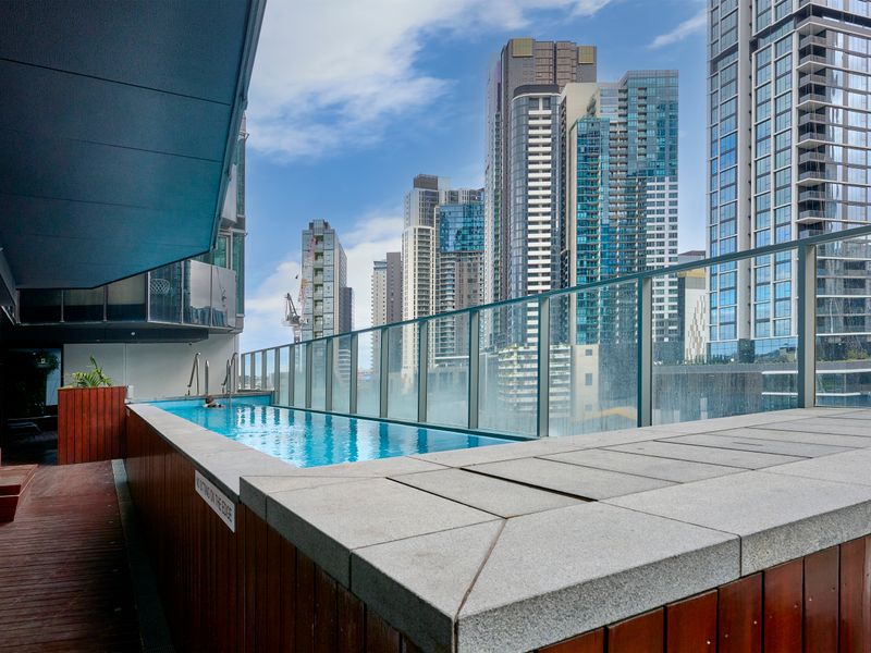 Outdoor pool with stunning high-rise city views.
