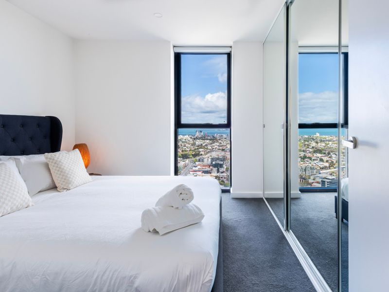 Peaceful bedroom featuring plush bedding and beautiful natural light