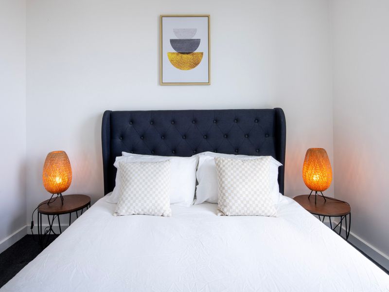 Comfortable bedroom with elegant decor and soft ambient lighting — perfect for a restful night’s sleep