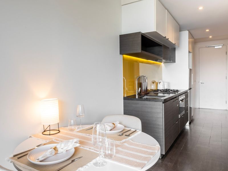 Spacious dining area with a table set for two, ideal for meals or planning your next adventure.