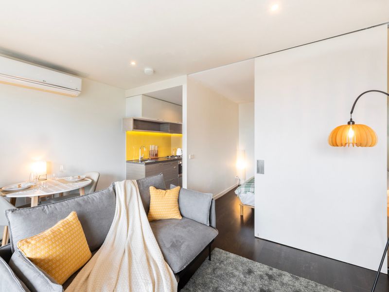 Bright and welcoming space with ample natural light, ideal for enjoying a meal or relaxing.