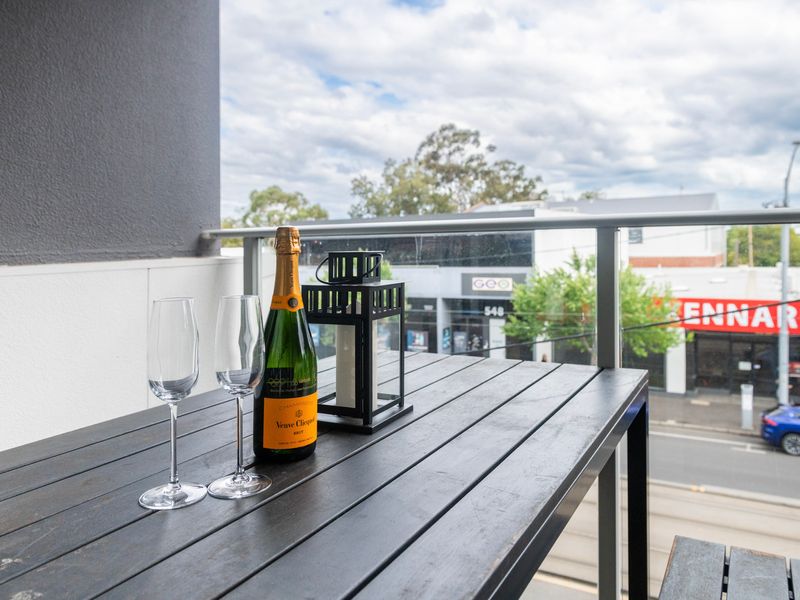 Outdoor balcony with a refreshing drink and stunning views, perfect for relaxing in the fresh air.