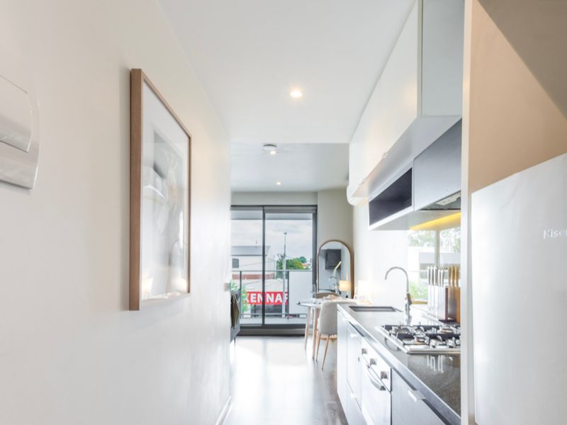 Open-plan kitchen, well-equipped for cooking or enjoying a snack at home.