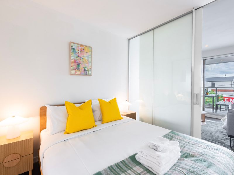 Bedroom featuring a calming, minimalistic design with soft textures and a peaceful ambiance.