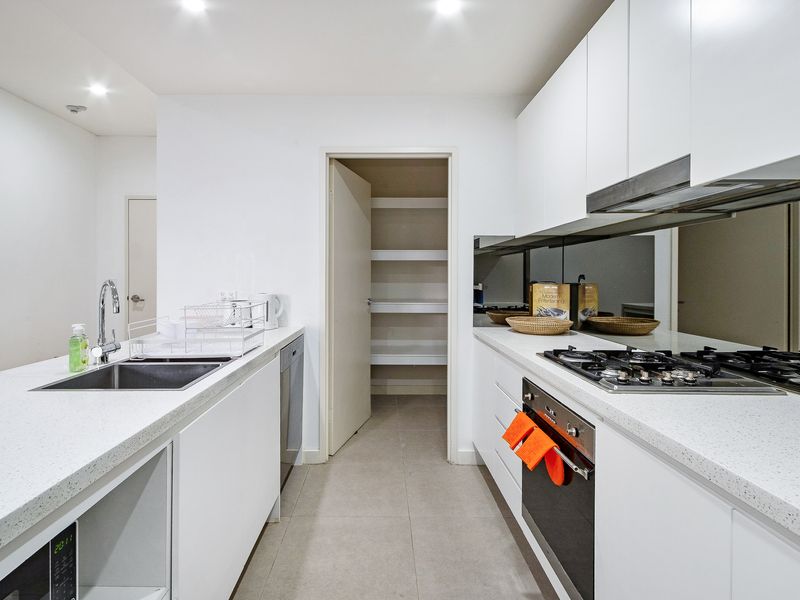 Spacious kitchen featuring ample storage and pantry.