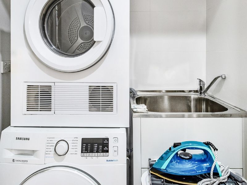 In-unit laundry with washer, dryer, and sink.