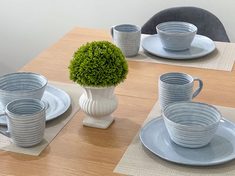 Elegant table setting with modern dishware.