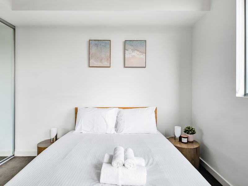 Bright bedroom with natural light and modern décor.