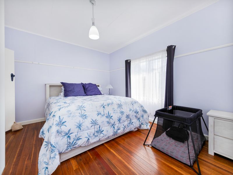 Light-filled bedroom designed for comfort and relaxation.