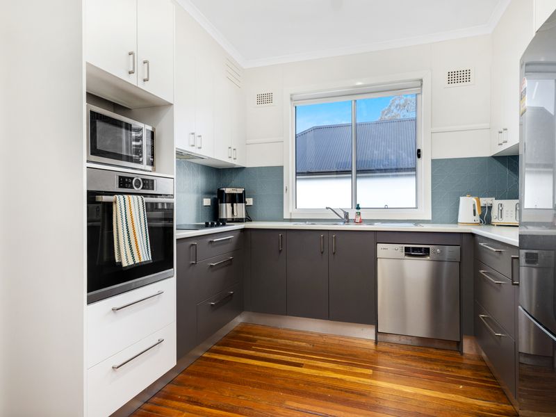 Fully equipped kitchen with modern appliances for home-style cooking.