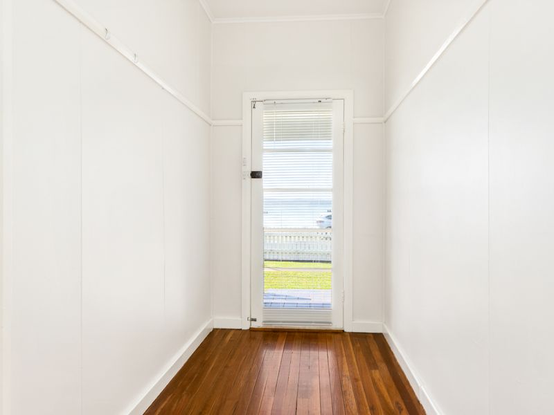 Main door offering a peek of the seaside scenery