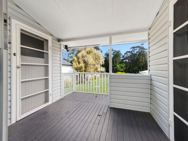 Welcoming front porch with a relaxing outlook.