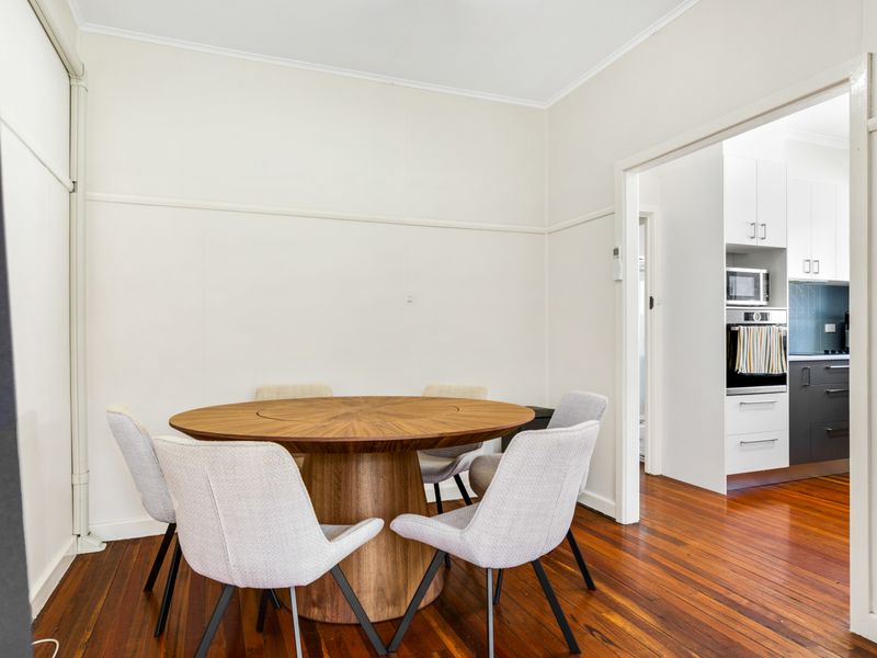 Inviting dining area with a round table, perfect for shared meals.