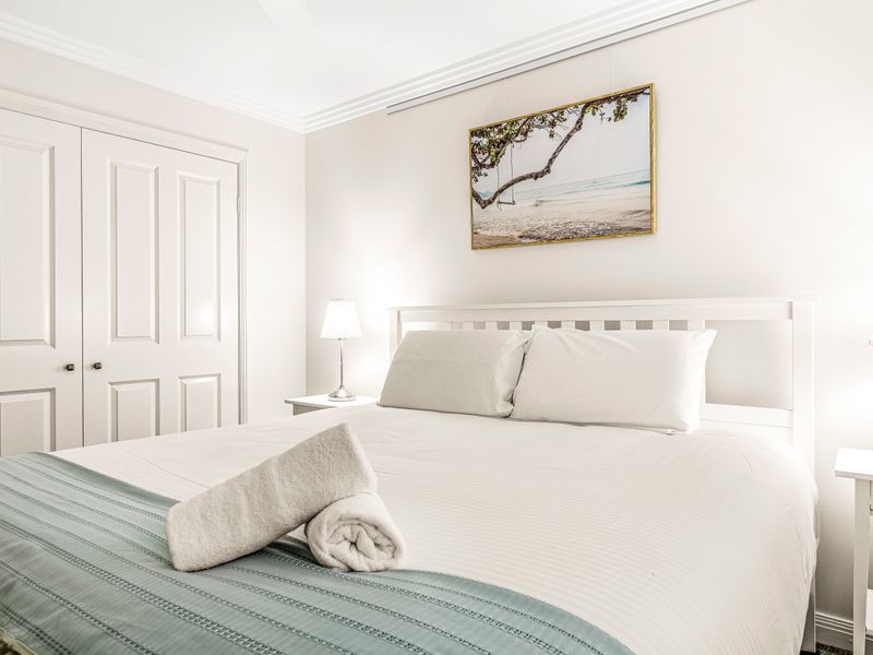 Rest easy in the spacious master bedroom with natural light