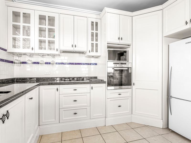 Stylish kitchen with modern appliances and plenty of counter space.
