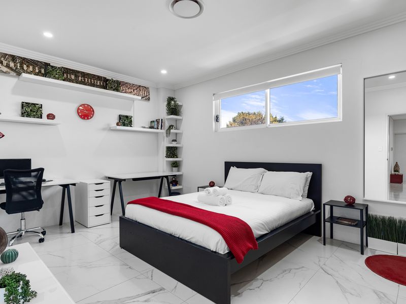 Comfortable bedroom featuring a handy workspace