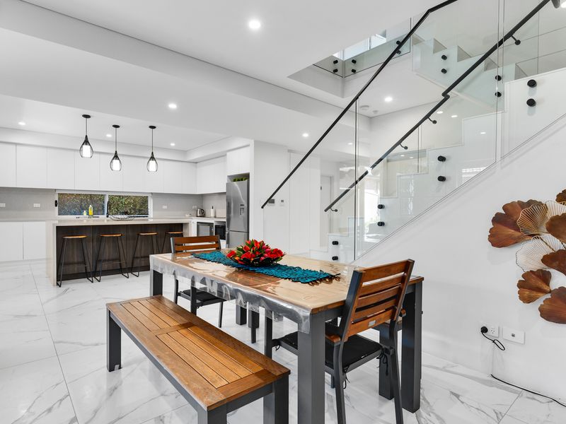 Seamless flow between kitchen and dining.