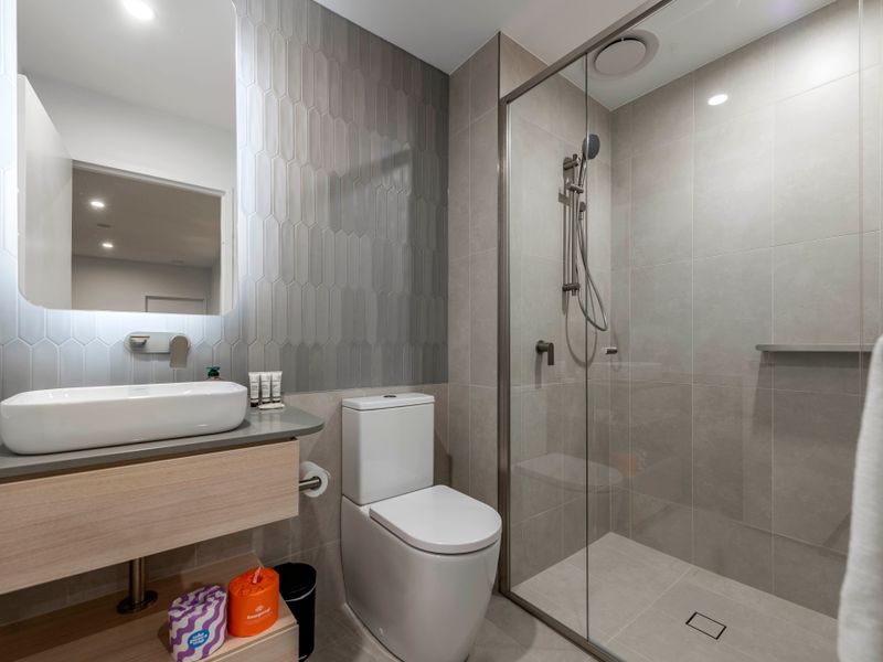 Bright bathroom with glass shower