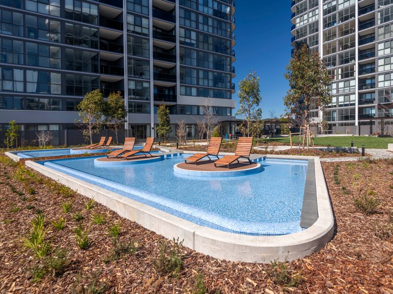 Resort-style outdoor pool with sun loungers