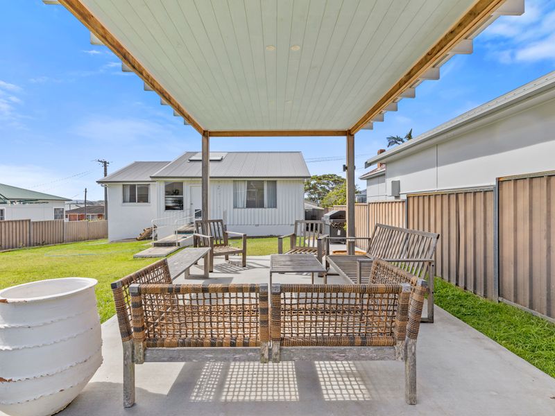 Sunlit guest room with crisp linens and peaceful garden views