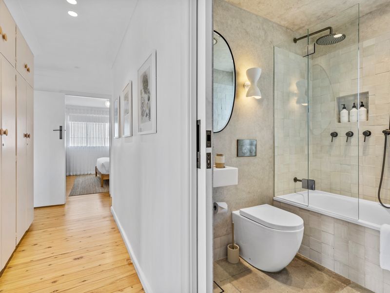 Fresh hallway leading to bedroom and bath