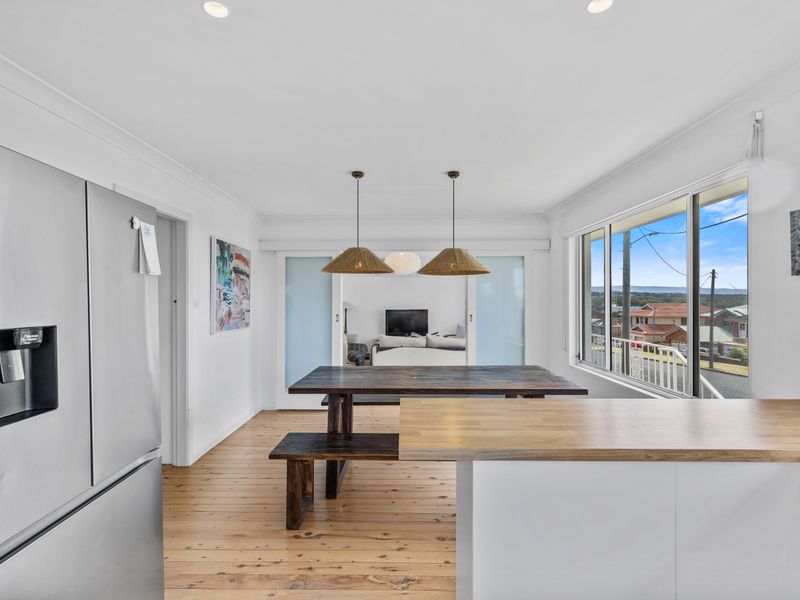 Bright and spacious kitchen-dining area with a relaxed coastal feel