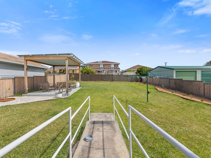 Spacious backyard with open lawn — ideal for kids or pets to play