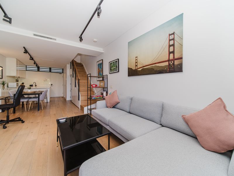 Open living area with sofa and TV.