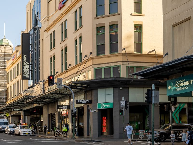 Street corner with restaurants and shops.