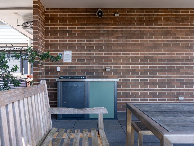 Outdoor BBQ with seating.