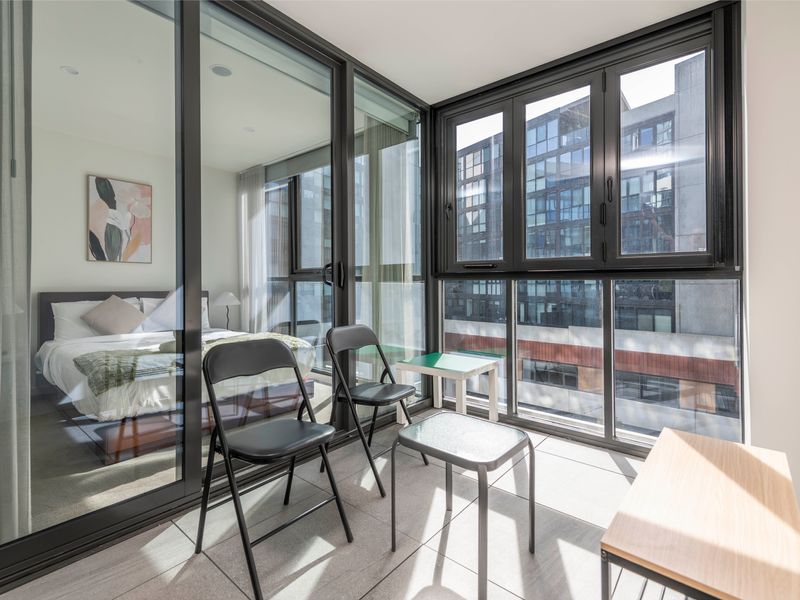 Private balcony with outdoor seating overlooking Braddon streets